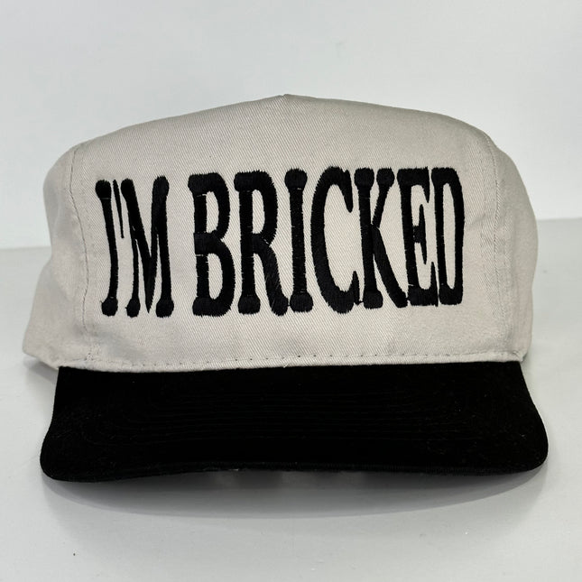 I’m Bricked on a tan and black Strapback Hat Cap custom embroidered